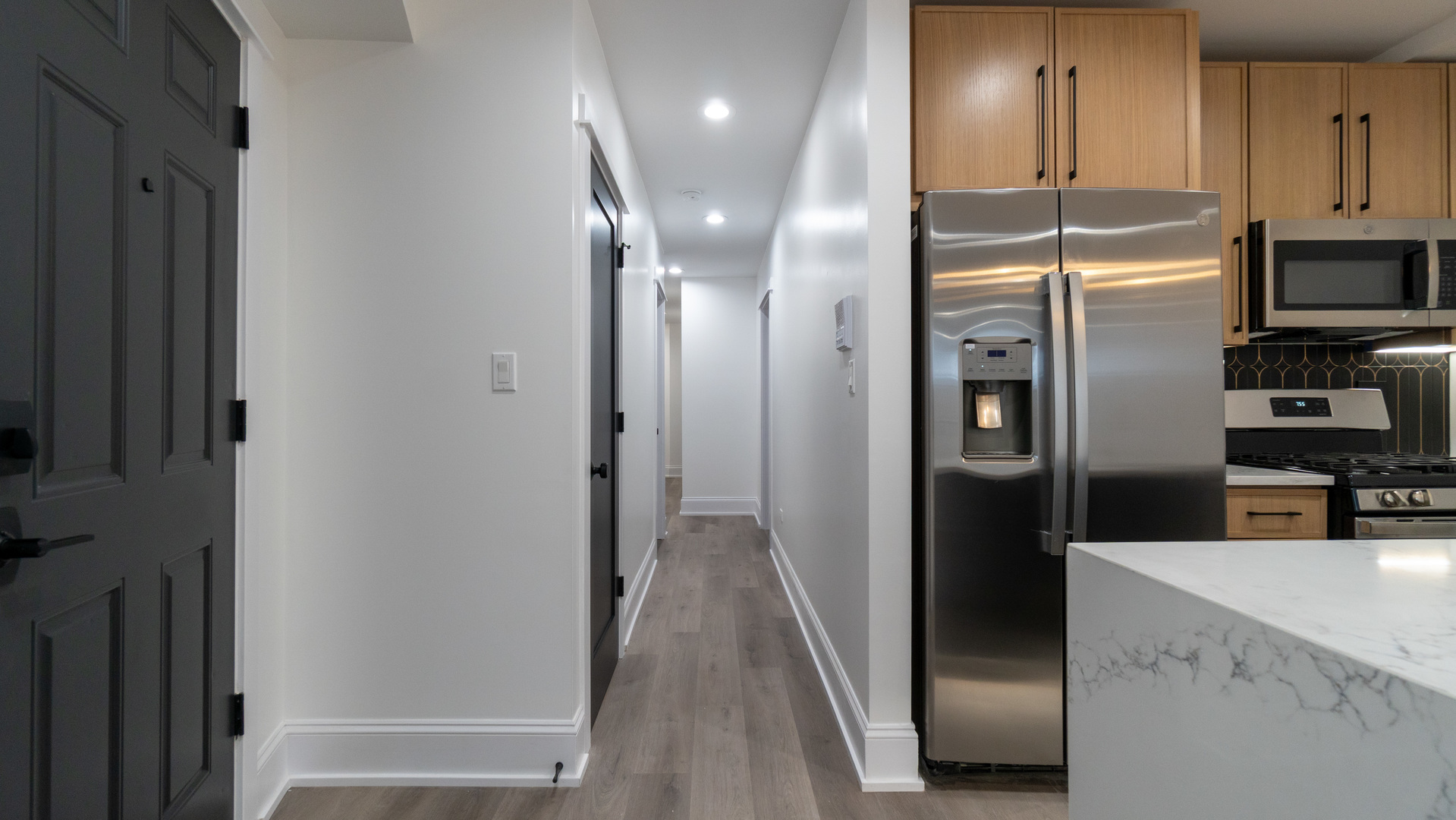 4745 North Beacon Street, Unit GS Chicago, IL 60640 - Photo 5 of 43 a kitchen with stainless steel appliances a refrigerator and a sink