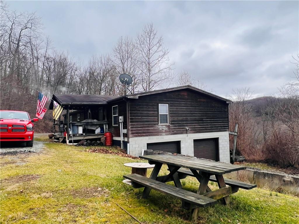 297 Oden Road Ruffs Dale, PA 15679 - Photo 7 of 24 a view of a chairs and tables in the patio