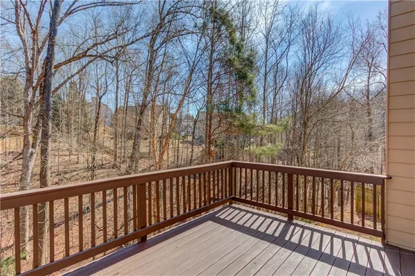 a view of balcony with wooden floor