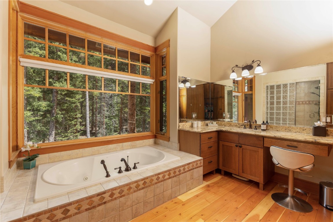 280 County Road 268 Keystone, CO 80435 - Photo 20 of 40 a spacious bathroom with a tub a sink and mirror