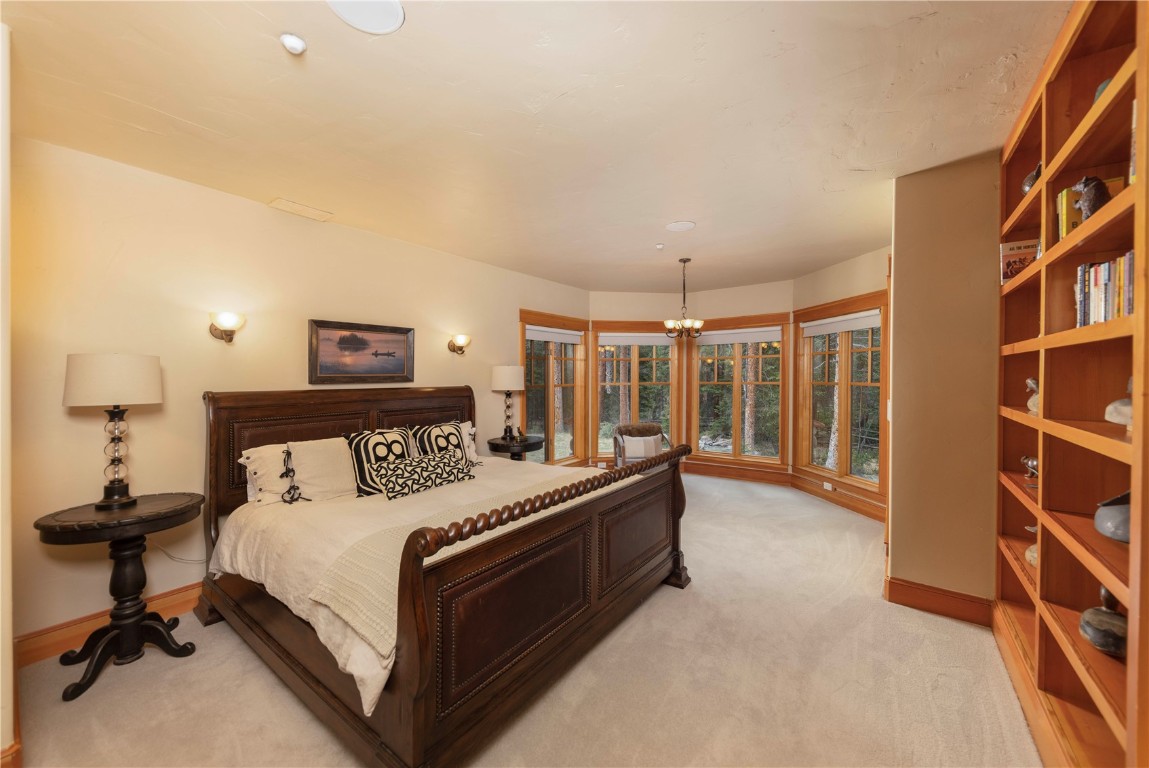 280 County Road 268 Keystone, CO 80435 - Photo 24 of 40 a bed room with a bed and a book shelf