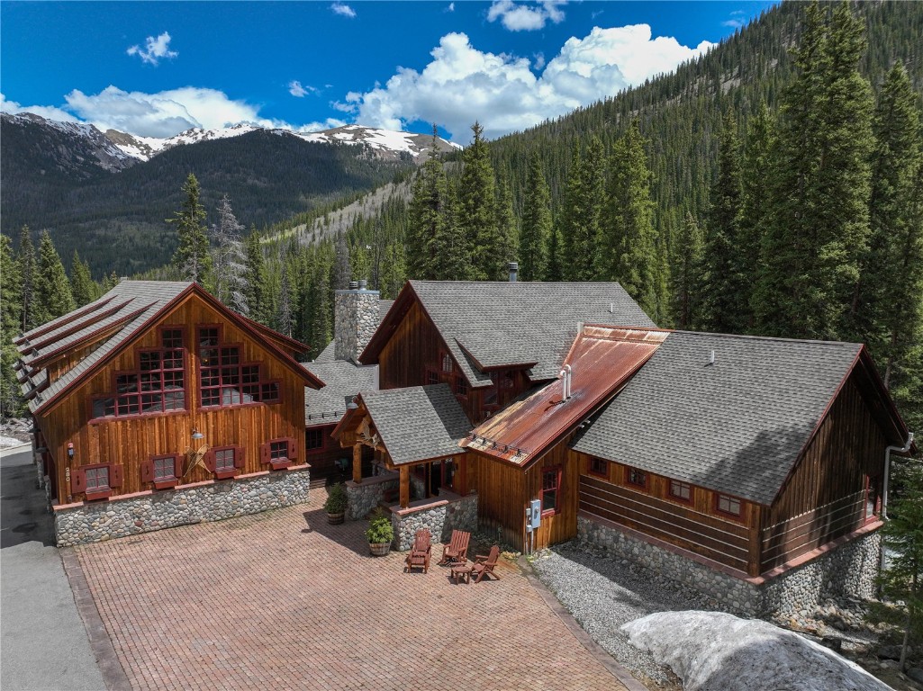 280 County Road 268 Keystone, CO 80435 - Photo 38 of 40 a roof deck with table and chairs under an umbrella
