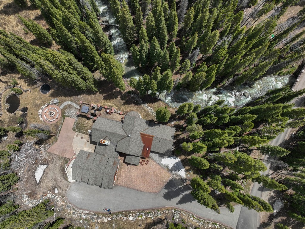 280 County Road 268 Keystone, CO 80435 - Photo 39 of 40 a view of a fire pit with large trees