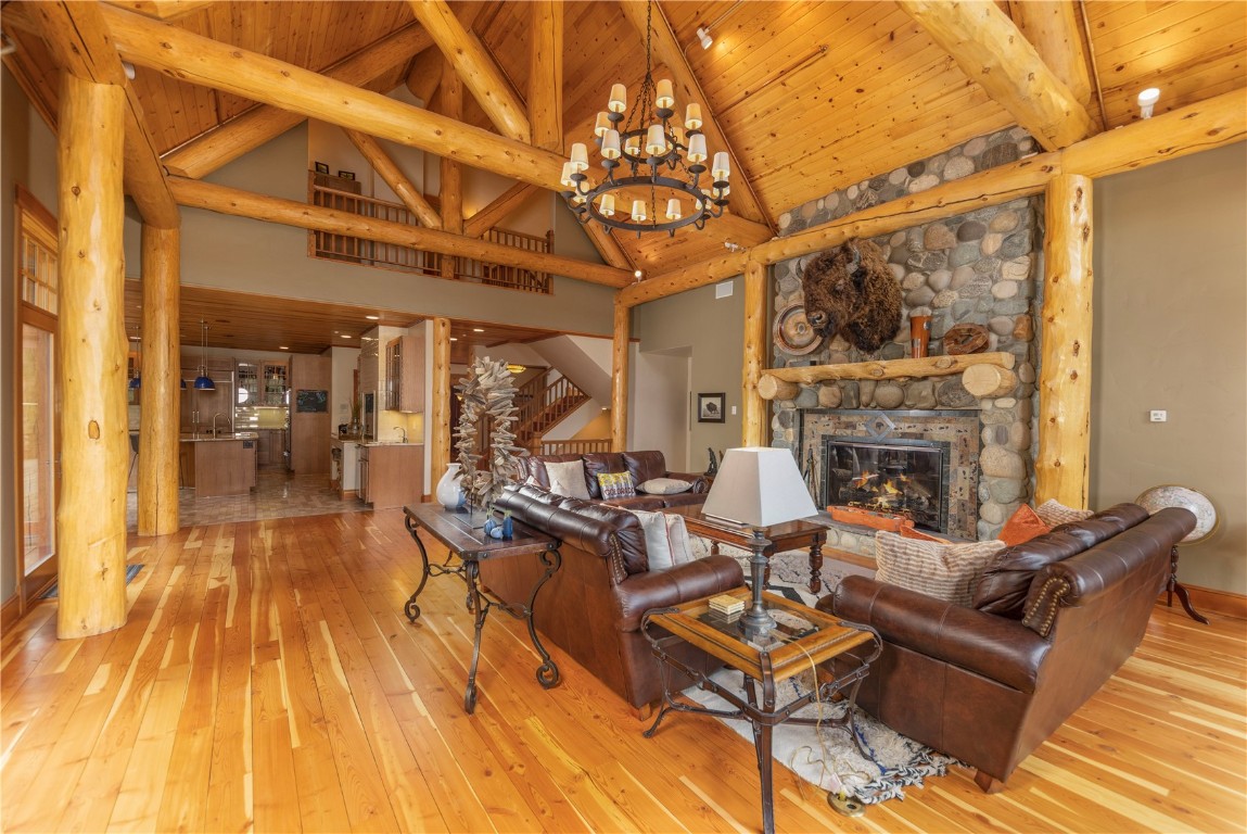 280 County Road 268 Keystone, CO 80435 - Photo 9 of 40 a living room with furniture a fireplace and a table with wooden floor