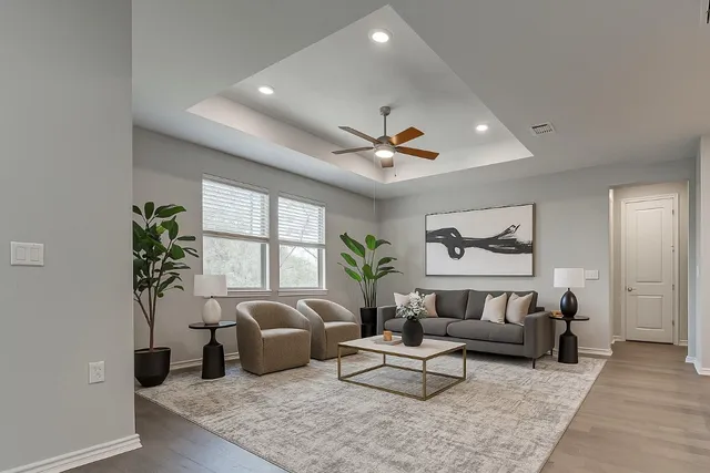 a living room with furniture and a large window