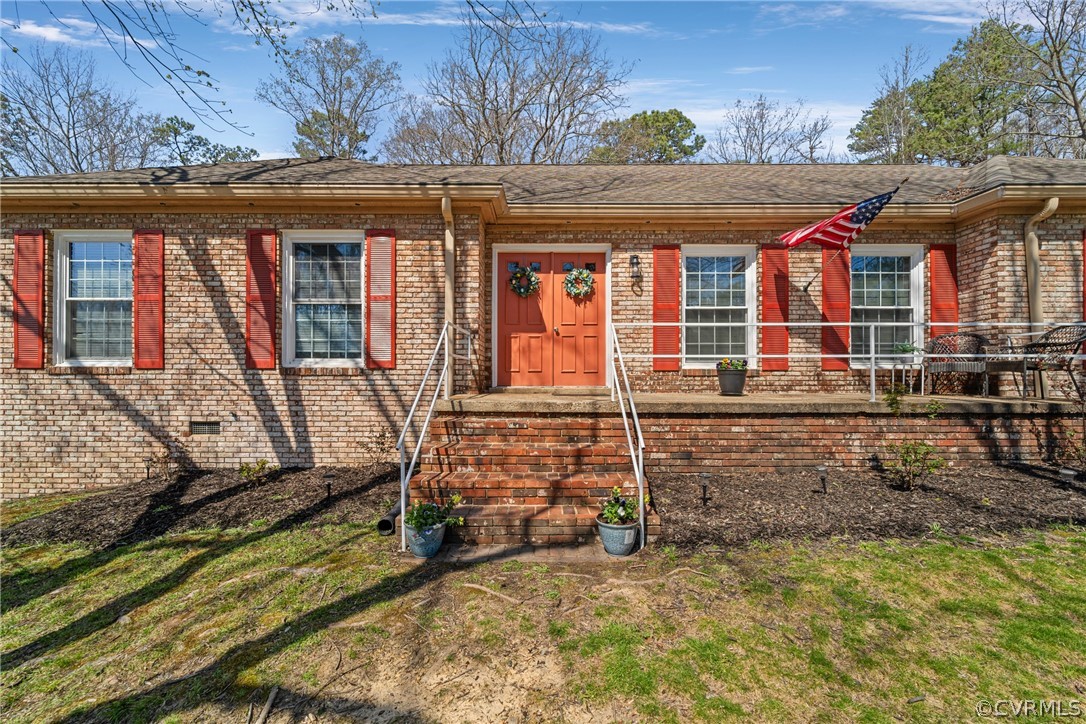 front view of a house with a large window