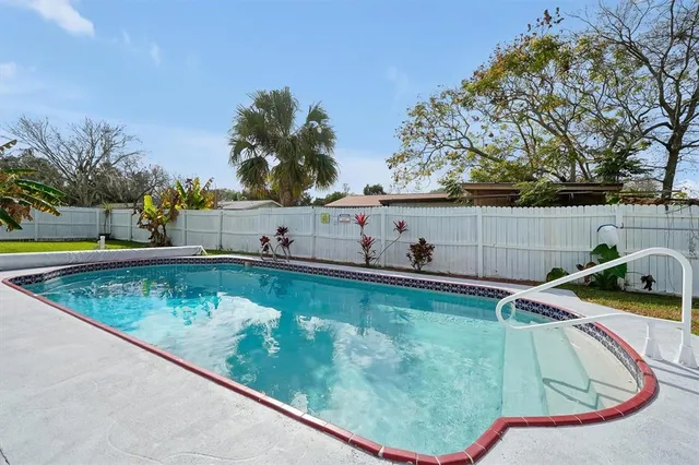 a view of a swimming pool with a lounge chairs