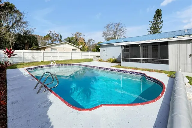 a view of a swimming pool with a lounge chairs