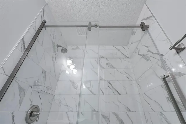 a bathroom with a shower and a shower head
