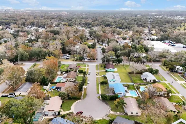 an aerial view of residential houses with outdoor space