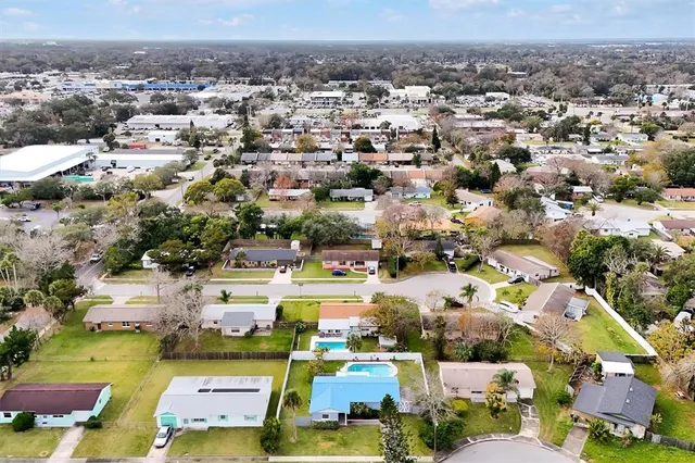 an aerial view of a houses with a lake view