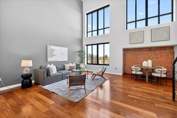 a living room with furniture dining table and a fireplace
