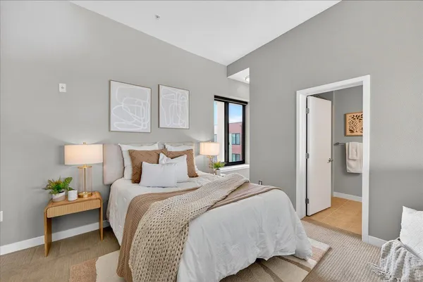 a bed room with a bed and a night stand