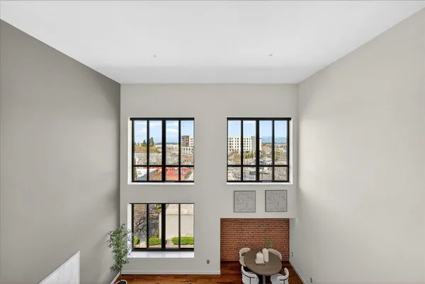a view of a patio with a table and chairs next to a yard