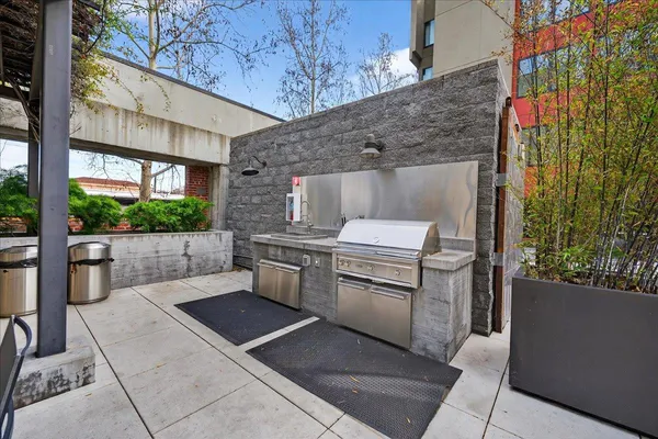 a view of a patio with a table and chairs