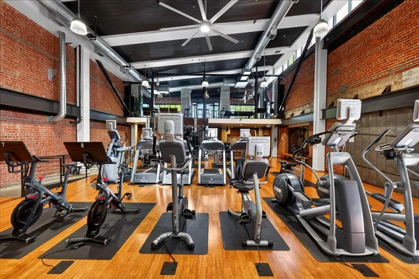 a brick building with a street sign on the wall