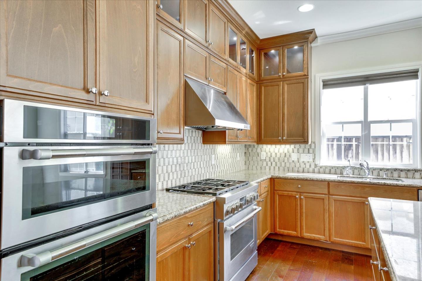 1345 Bayberry View Lane San Ramon, CA 94582 - Photo 11 of 65 a kitchen with stainless steel appliances granite countertop a stove and a sink