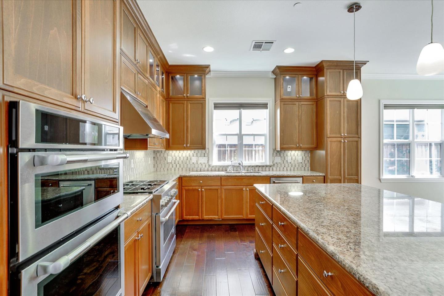1345 Bayberry View Lane San Ramon, CA 94582 - Photo 12 of 65 a kitchen with stainless steel appliances granite countertop a stove a sink and a refrigerator