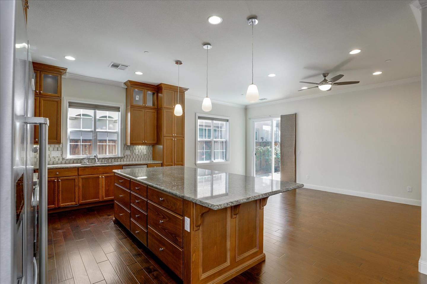 1345 Bayberry View Lane San Ramon, CA 94582 - Photo 14 of 65 a large kitchen with kitchen island a stove a sink a refrigerator and wooden floor