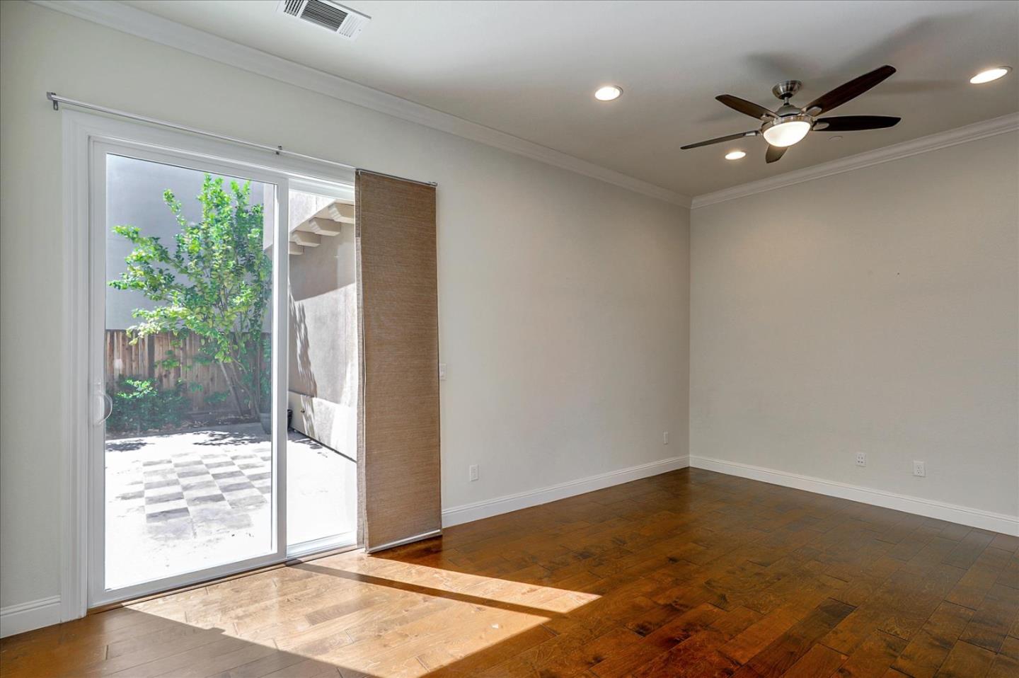 1345 Bayberry View Lane San Ramon, CA 94582 - Photo 16 of 65 an empty room with wooden floor and windows