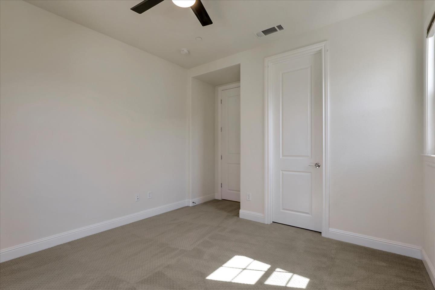 1345 Bayberry View Lane San Ramon, CA 94582 - Photo 30 of 65 an empty room with a window and a ceiling fan