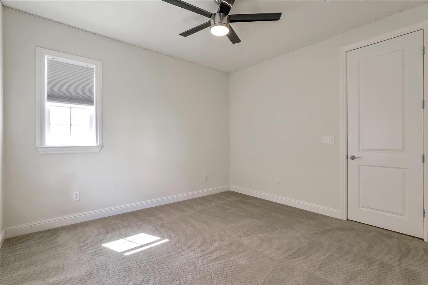 1345 Bayberry View Lane San Ramon, CA 94582 - Photo 34 of 65 an empty room with a window and a ceiling fan