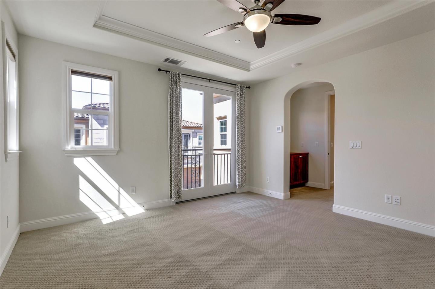 1345 Bayberry View Lane San Ramon, CA 94582 - Photo 37 of 65 a view of an empty room with chandelier fan and windows