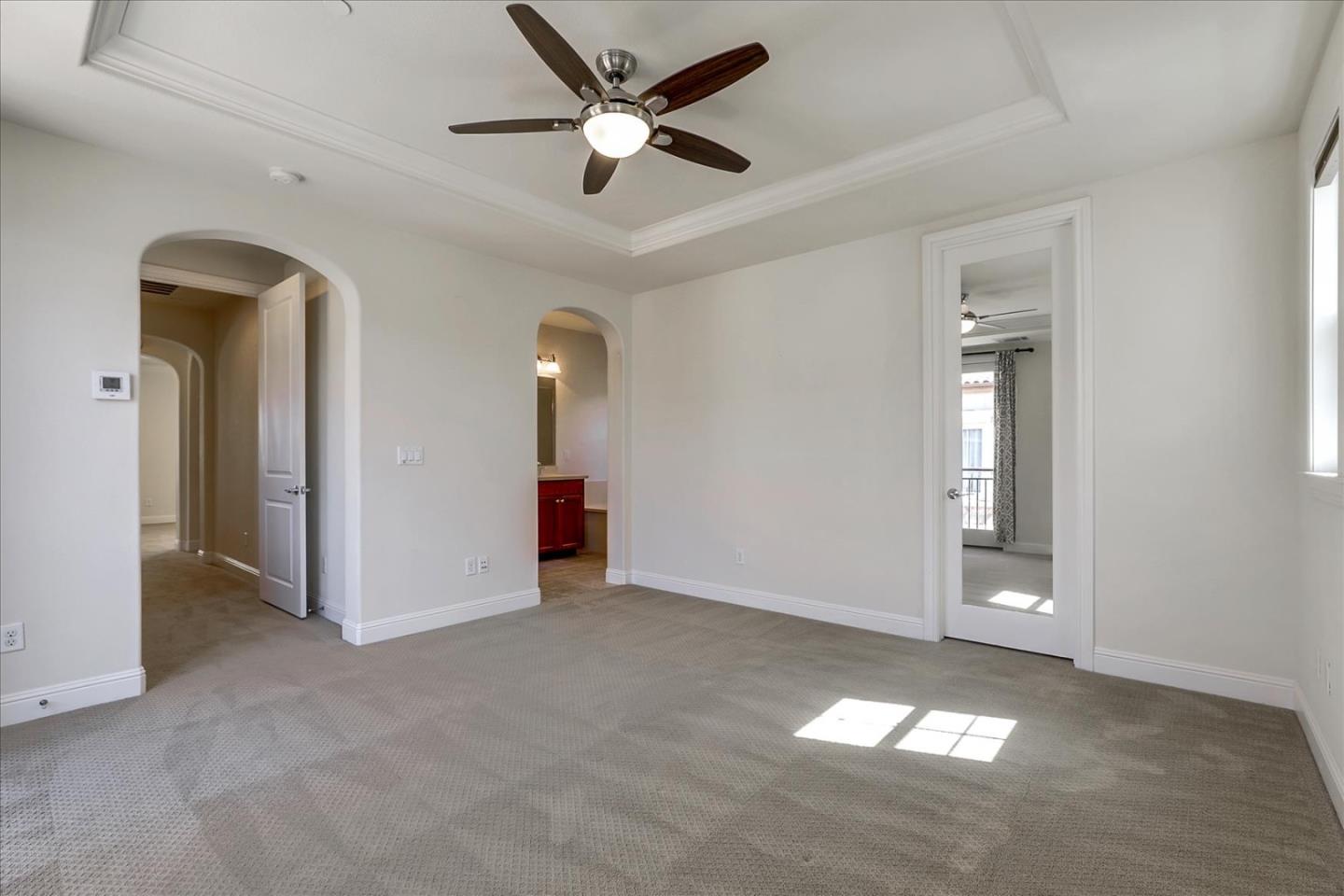 1345 Bayberry View Lane San Ramon, CA 94582 - Photo 38 of 65 an empty room with a ceiling fan and a window