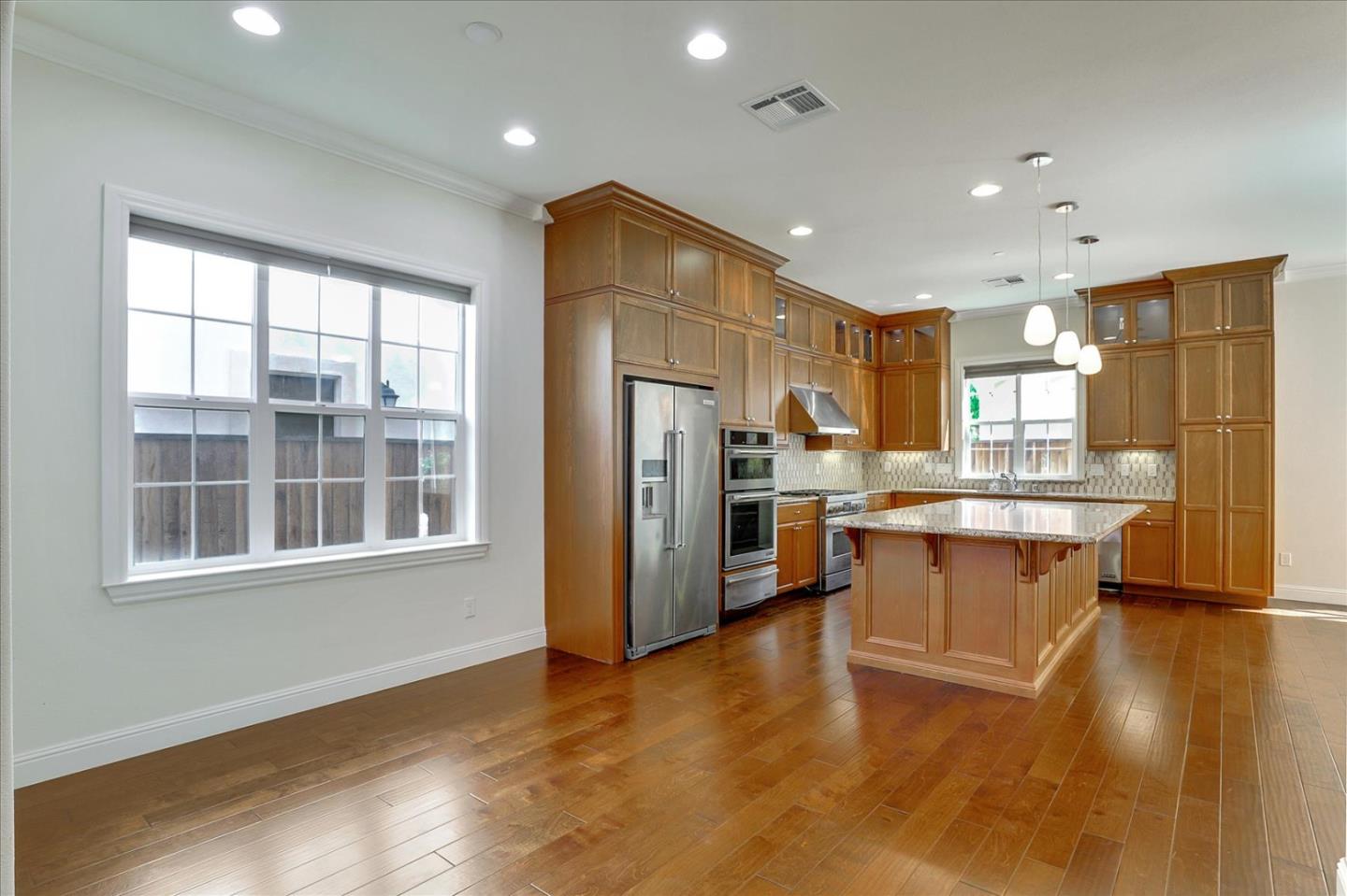 1345 Bayberry View Lane San Ramon, CA 94582 - Photo 4 of 65 a large kitchen with a large counter top appliances and cabinets