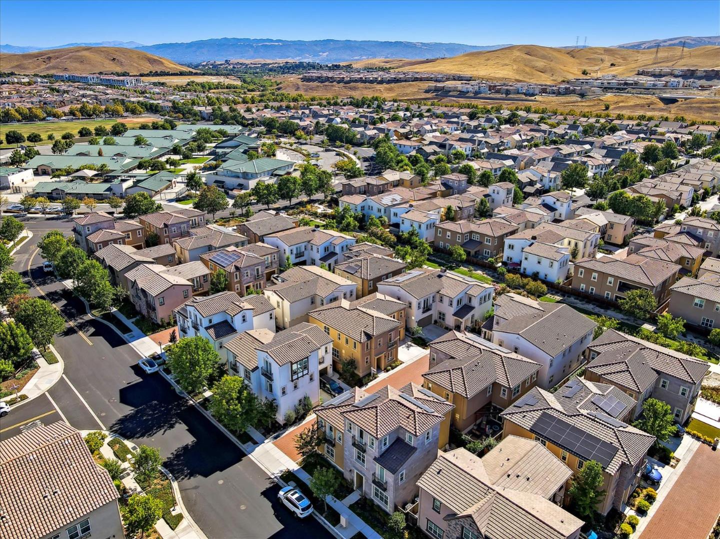 1345 Bayberry View Lane San Ramon, CA 94582 - Photo 60 of 65 an aerial view of a city with lots of residential buildings and mountain view in back