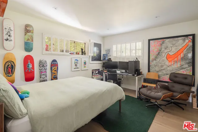 a bedroom with a bed and a couch