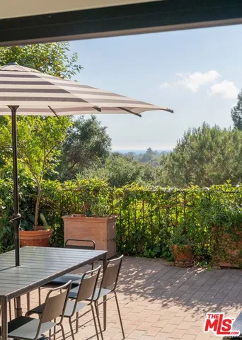 a view of balcony with furniture