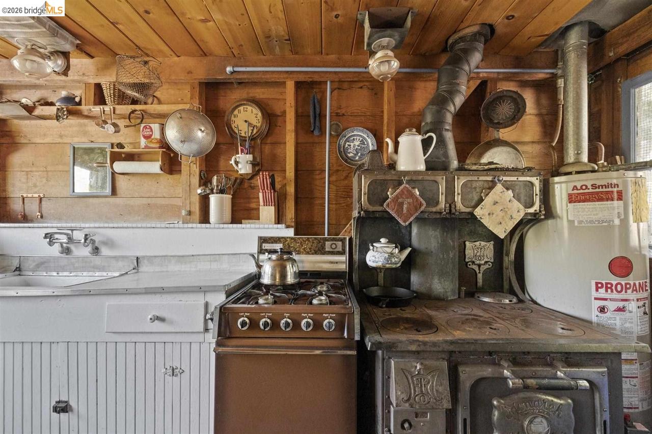 7 Riverside Tract Kyburz, CA 95720 - Photo 6 of 25 a kitchen with a stove and cabinets