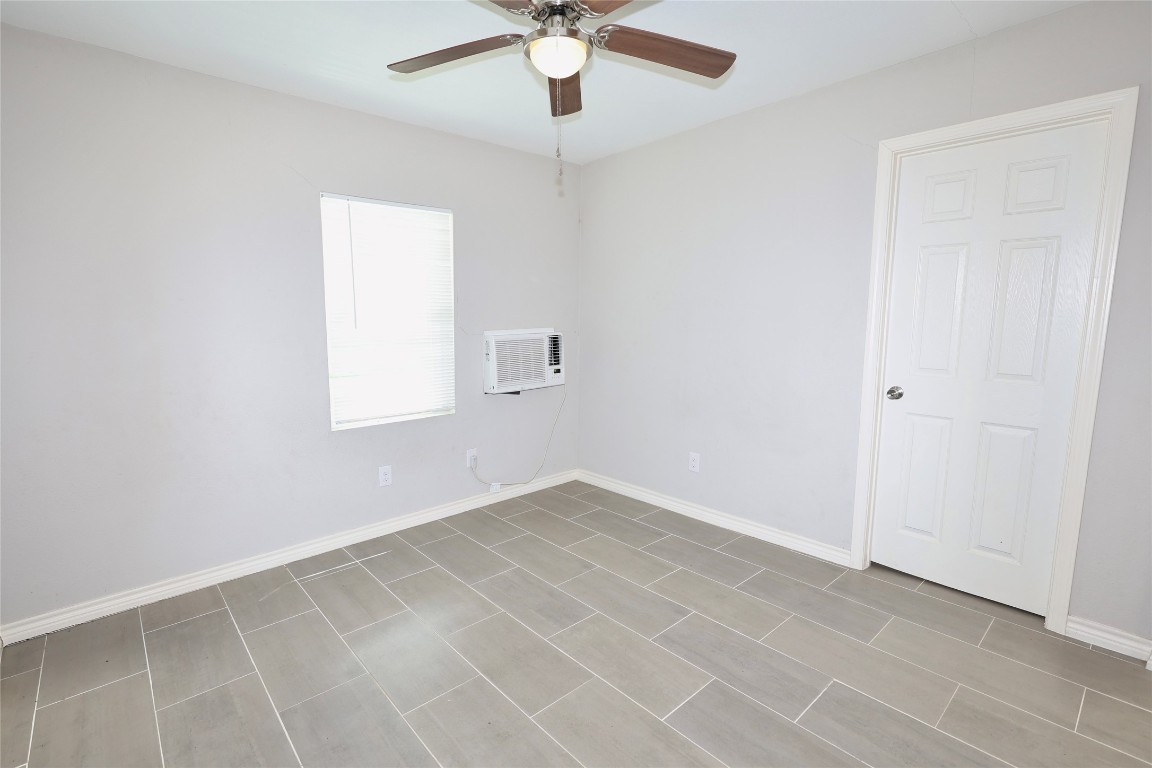 2220 Avenue L, Unit 110 Rosenberg, TX 77471 - Photo 8 of 10 Alternate view of the living room, here we see the door to the bedroom