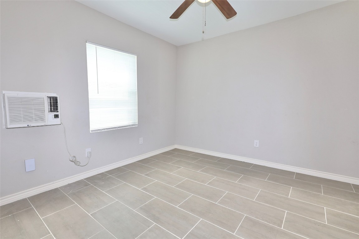 2220 Avenue L, Unit 110 Rosenberg, TX 77471 - Photo 9 of 10 Bedroom features ceiling fan