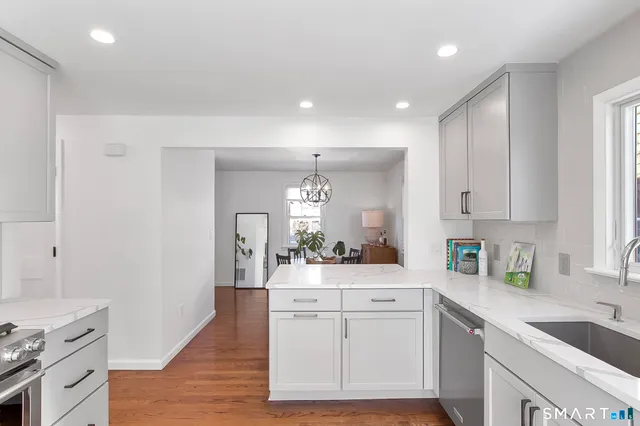 a view of kitchen with wooden floor