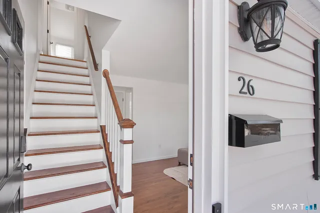 a living room with furniture and a lamp