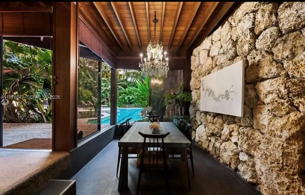 a front view of a house with sitting area