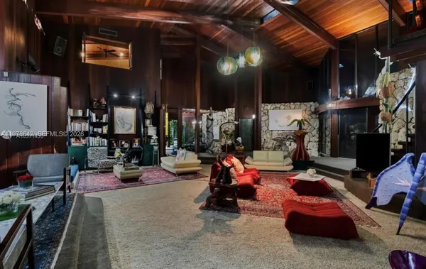 a view of a patio with dining table and chairs