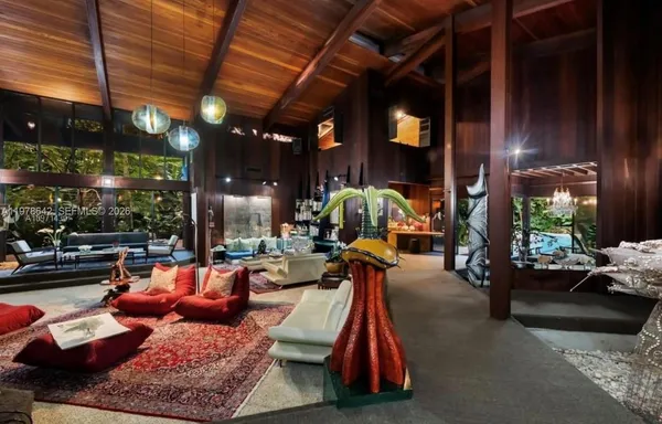 a living room filled with furniture and a table