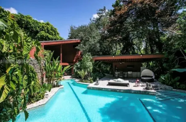 a view of swimming pool with patio