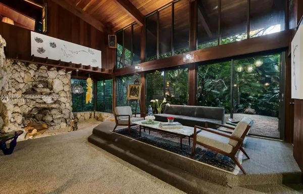 a outdoor living space with furniture and a fireplace