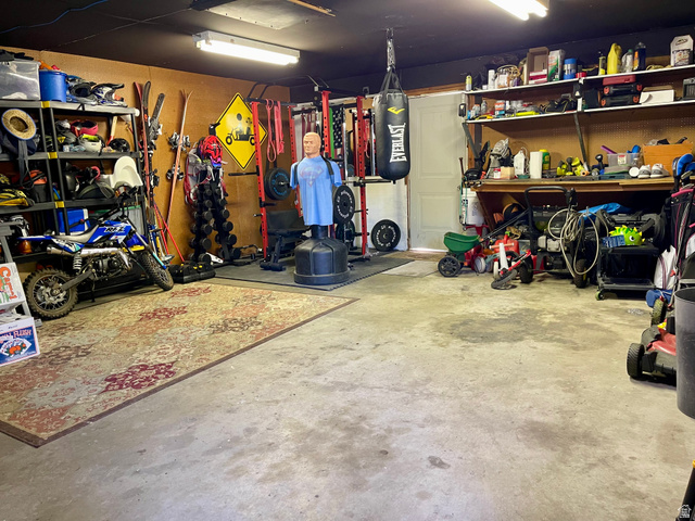 2444 Quail Run Drive Sandy, UT 84093 - Photo 23 of 23 2 car garage with work benchand heavy duty shelving