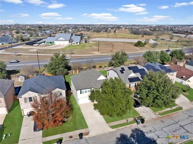 an aerial view of a house with a lake view