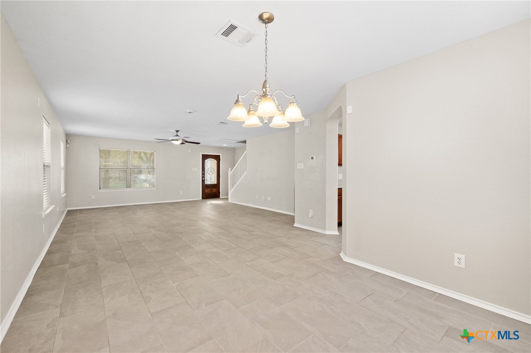 8420 Starview Street Temple, TX 76502 - Photo 10 of 36 a view of a room with chandelier and windows