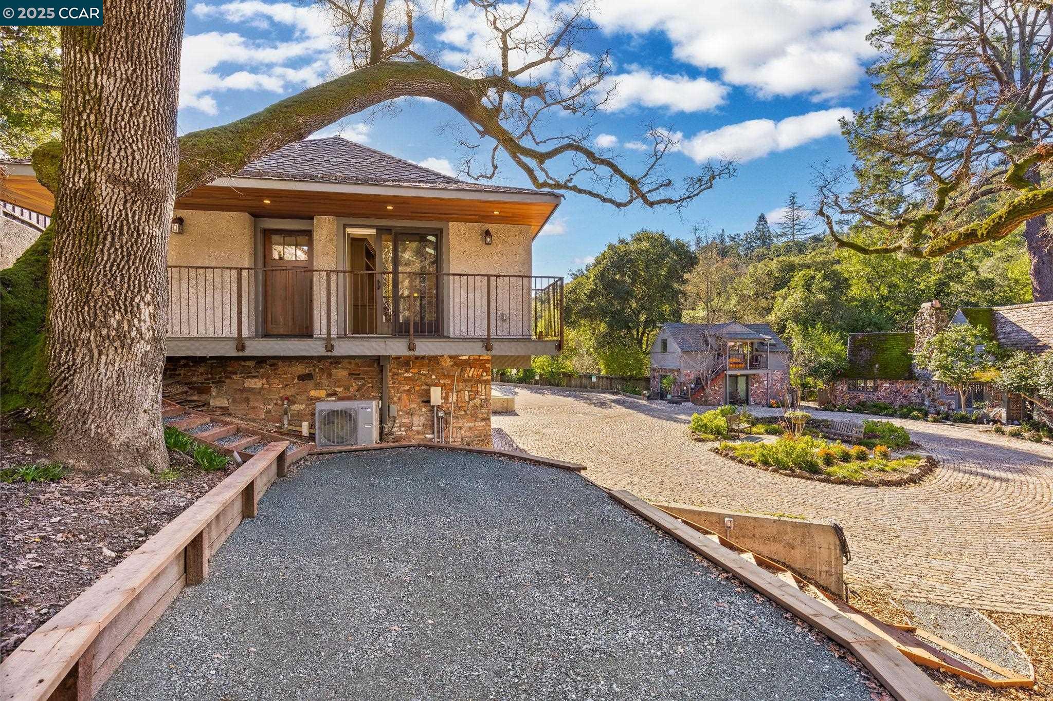 100 B Moraga Way Orinda, CA 94563 - Photo 13 of 48 a front view of a house with a garden and yard