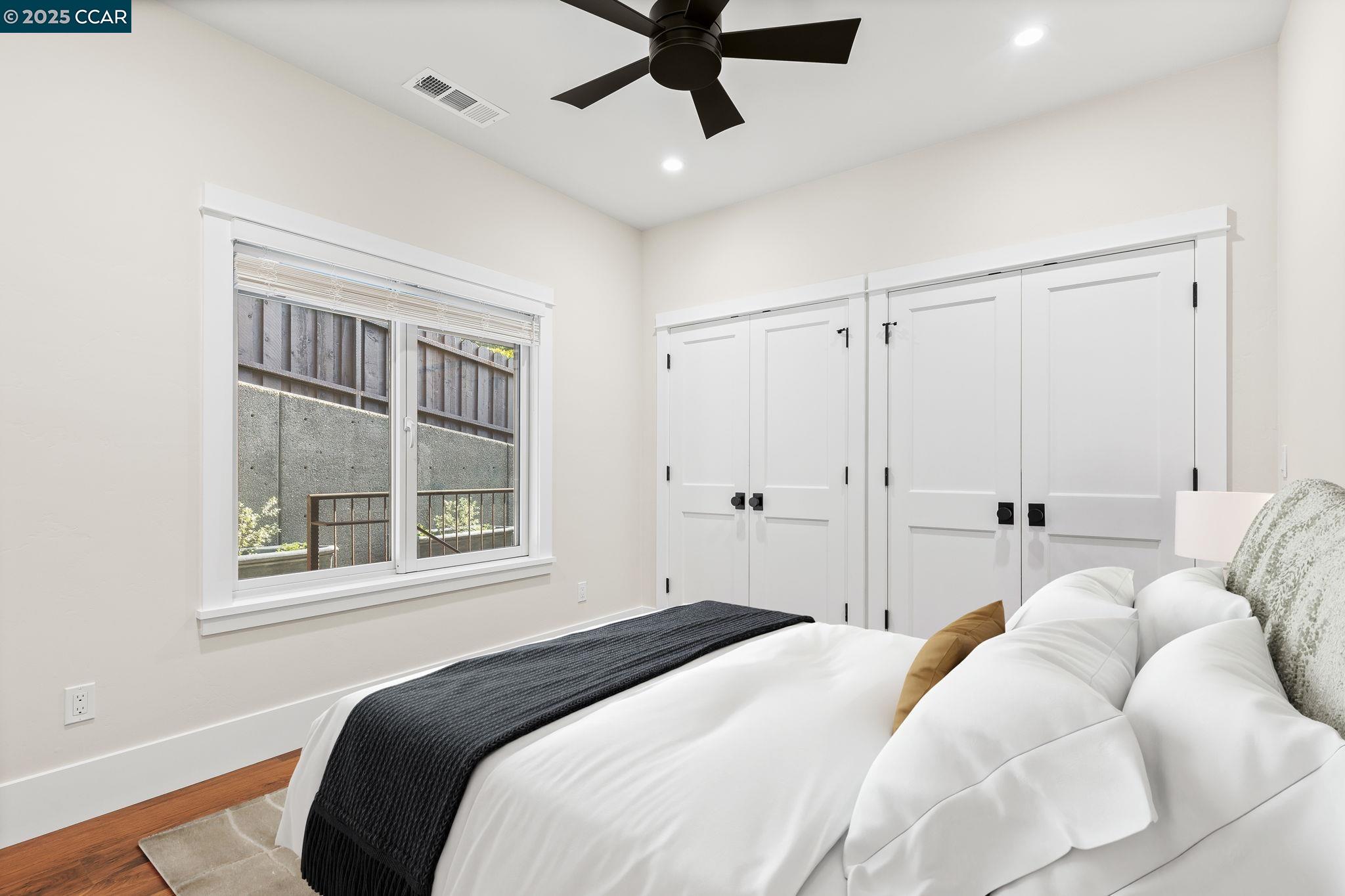 100 B Moraga Way Orinda, CA 94563 - Photo 19 of 48 a bedroom with a bed and a window