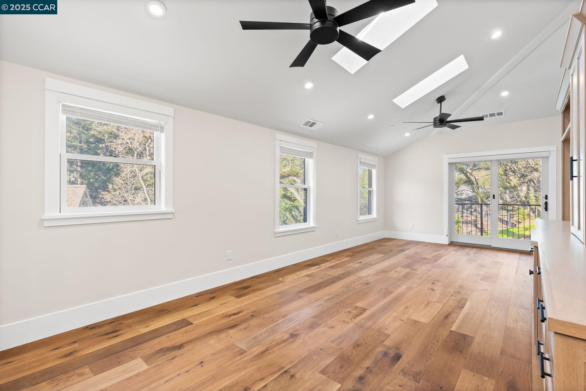 100 B Moraga Way Orinda, CA 94563 - Photo 25 of 48 a view of an empty room with a window and wooden floor
