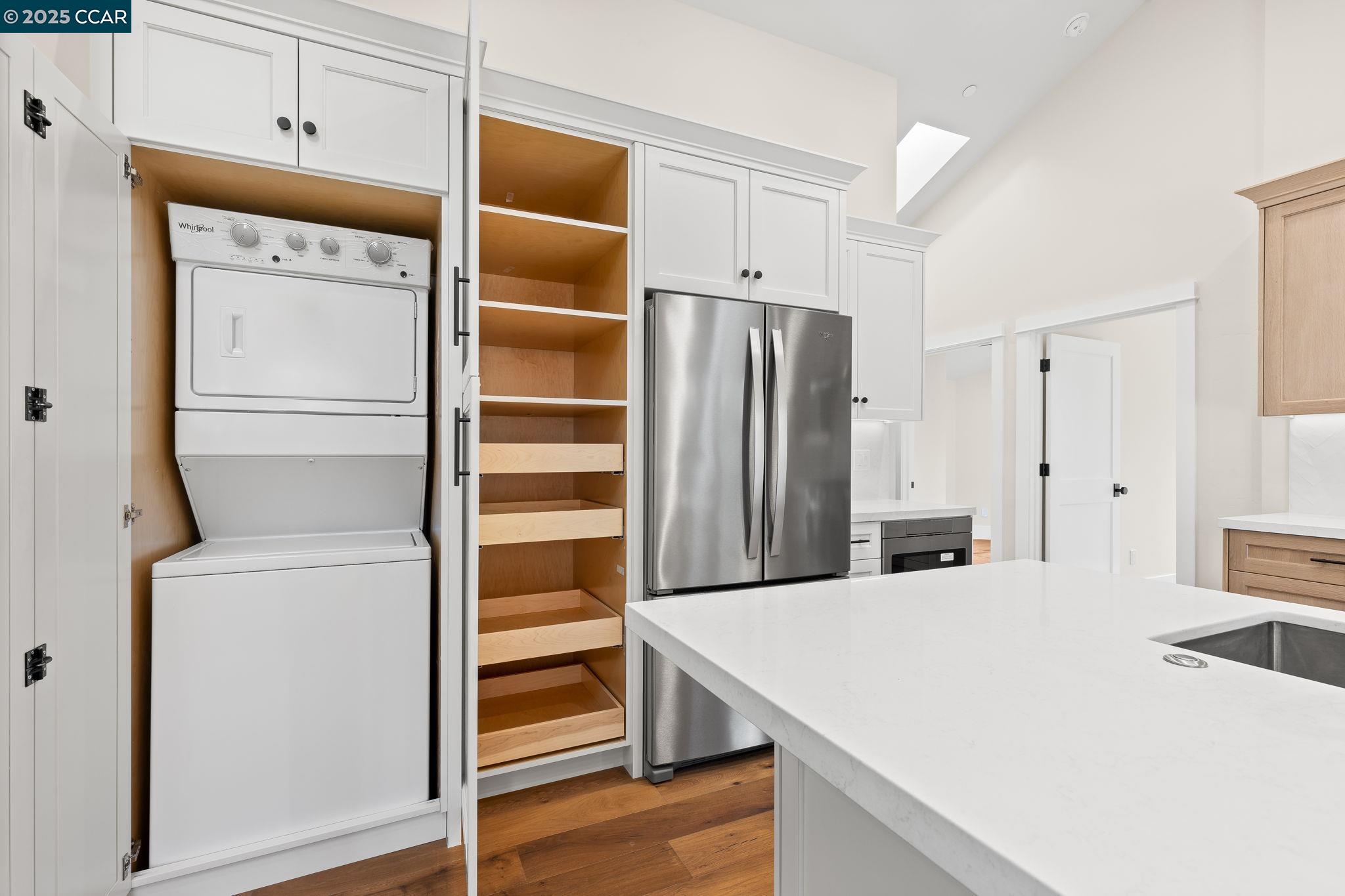 100 B Moraga Way Orinda, CA 94563 - Photo 29 of 48 a kitchen with stainless steel appliances a refrigerator and cabinets