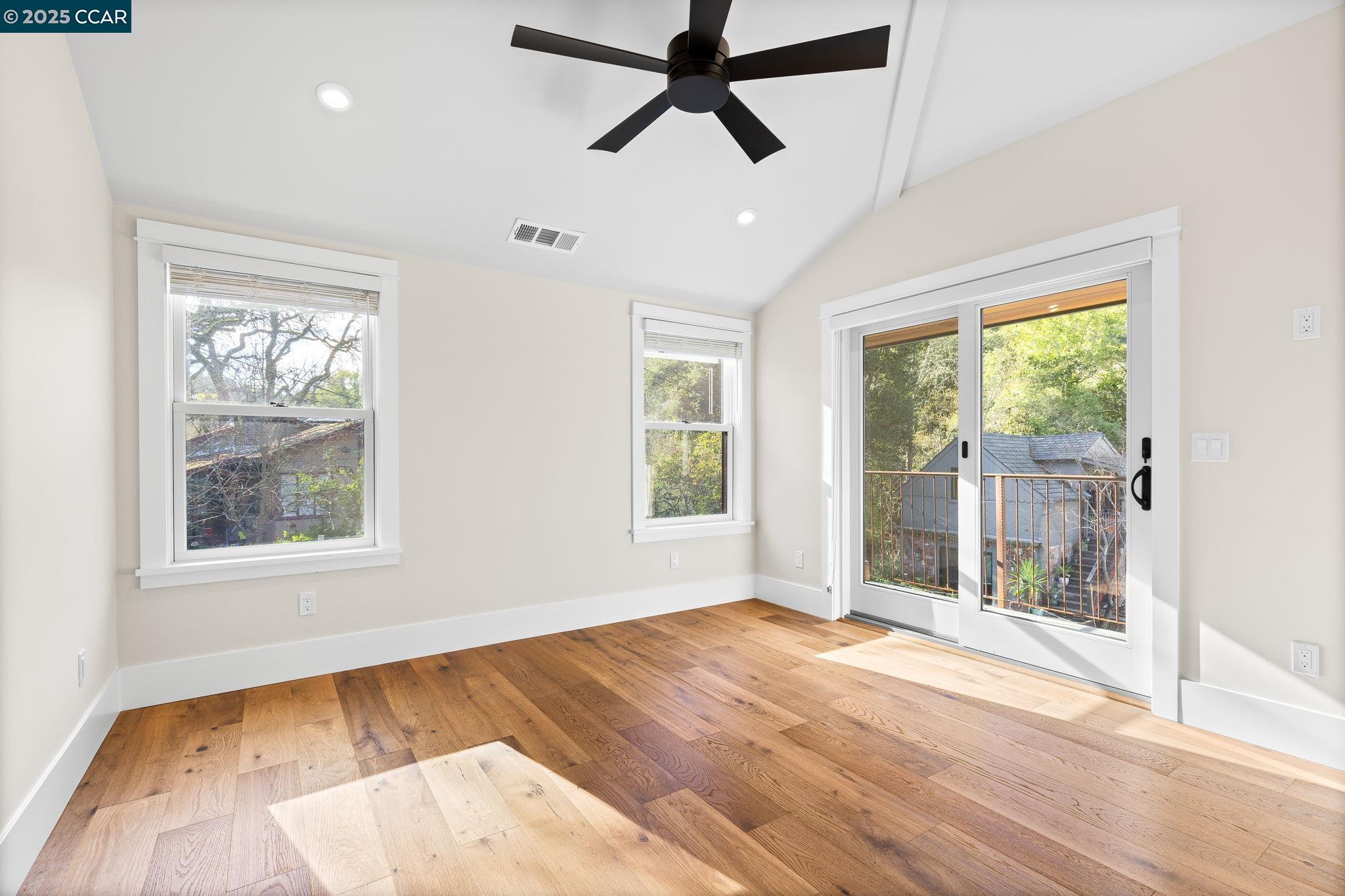100 B Moraga Way Orinda, CA 94563 - Photo 36 of 48 a view of empty room with wooden floor and fan